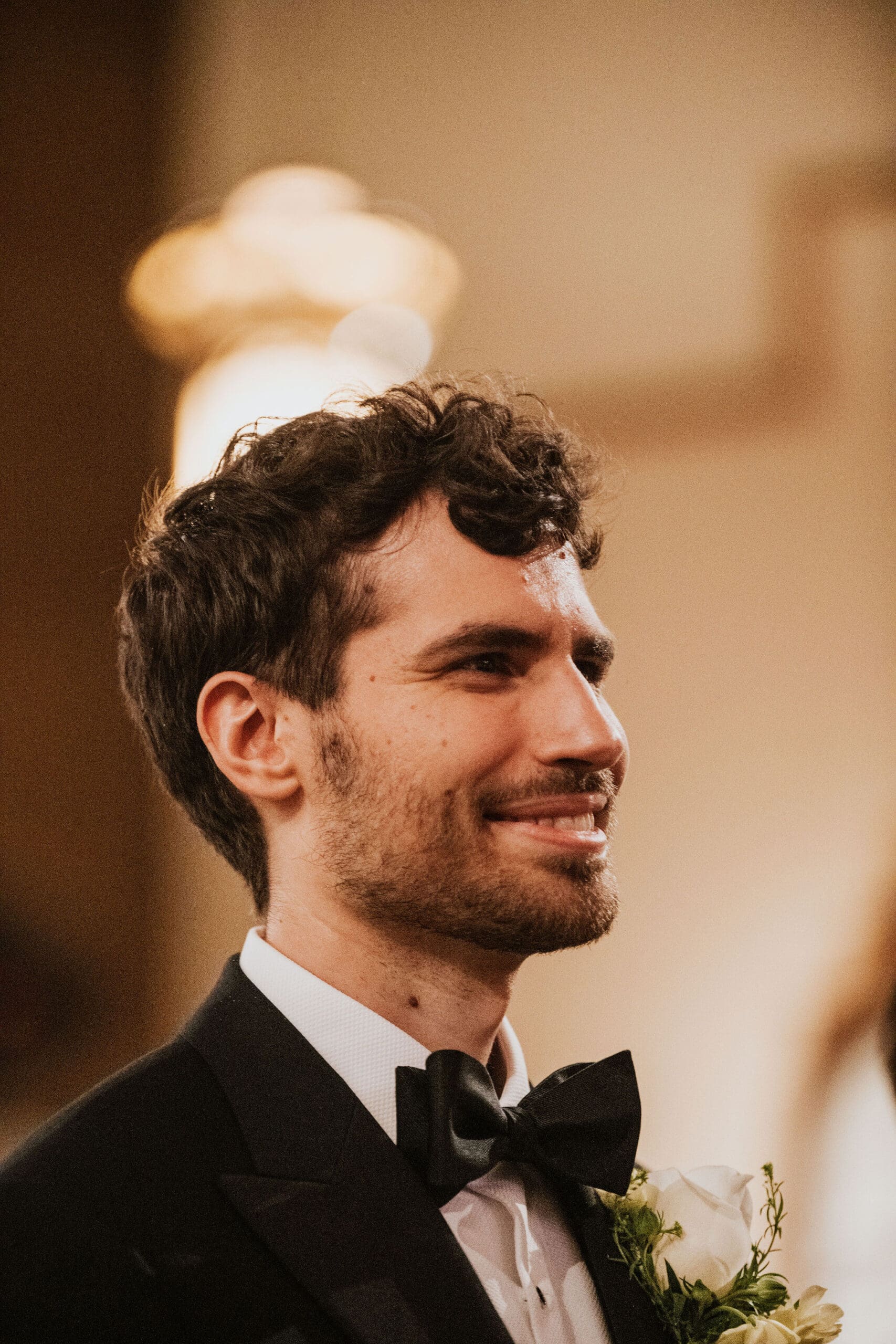 An intimate close up of the groom seeing this bride for the first time at St. Mary of the Assumption Parish