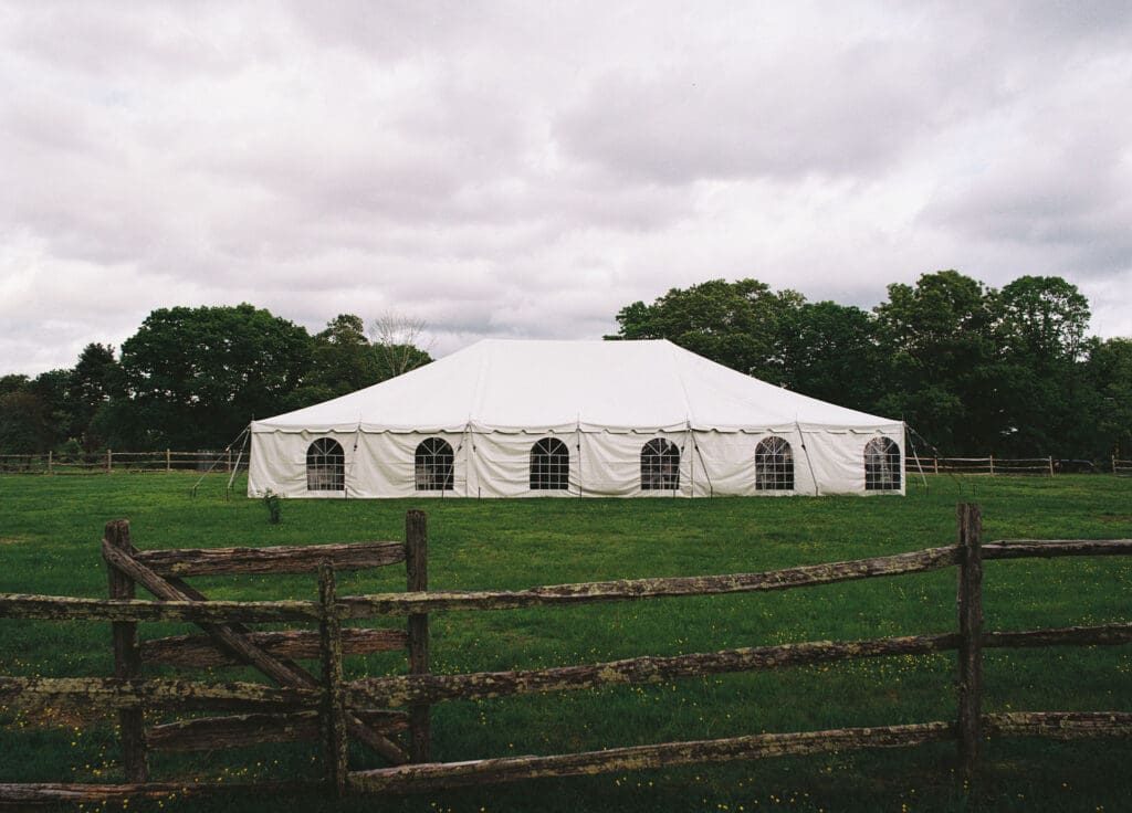 a film photo of a wedding reception tent at an outdoor venue