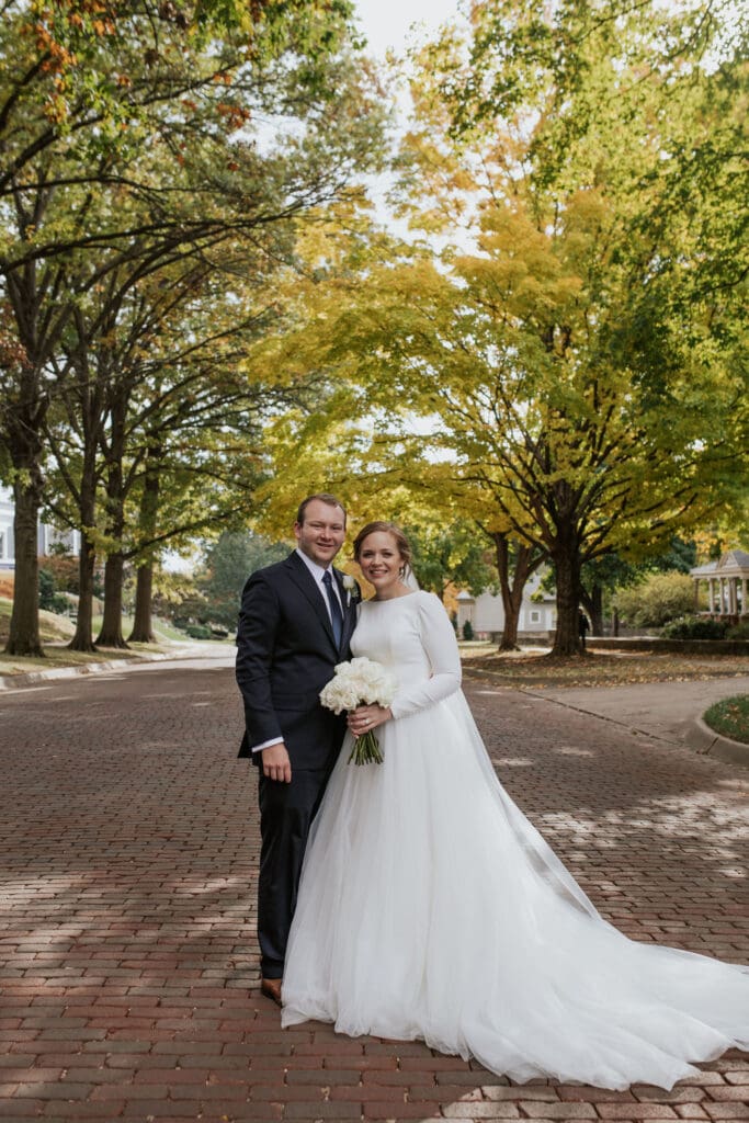 Atchison wedding photographer captures couple surrounded by fall colors on 4th Street