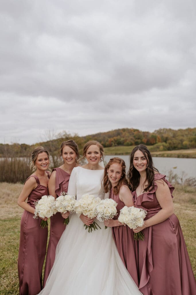 bride and her bridesmaids on a fall day in atchison kansas at the golf course