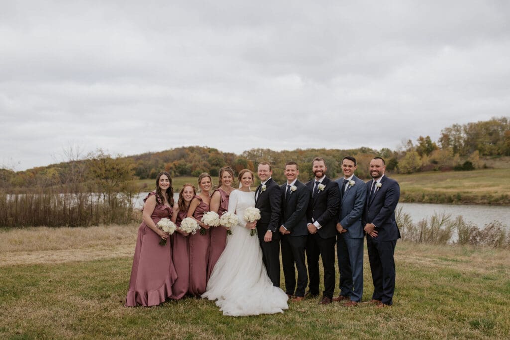 Wedding party together at Atchison Golf Club at Bellevue