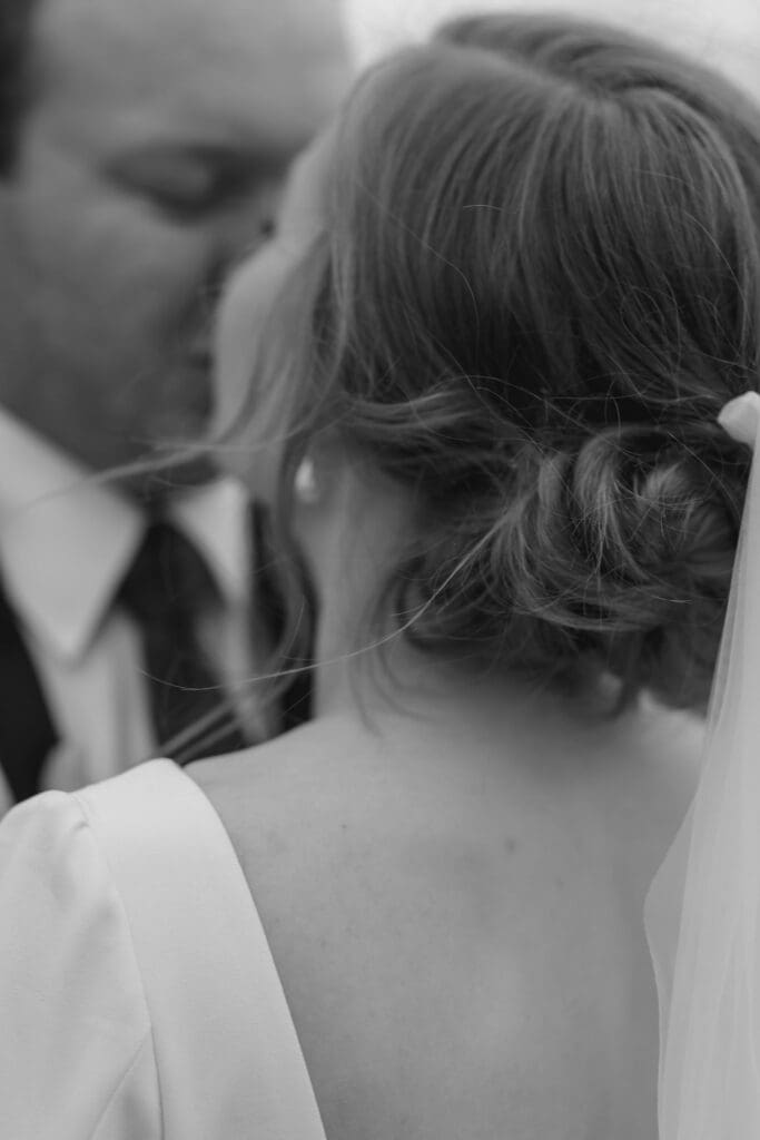 close up of a bride and groom kissing