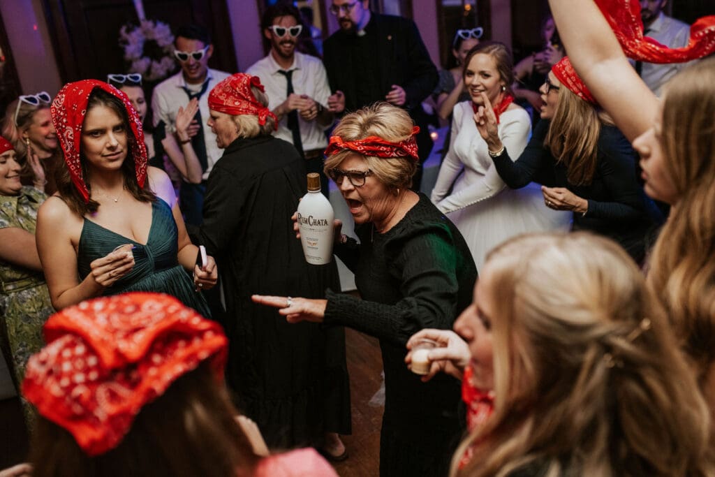 groom's aunt helps lead a family tradition on the dance floor at elizabeth's special events and catering in atchison kansas