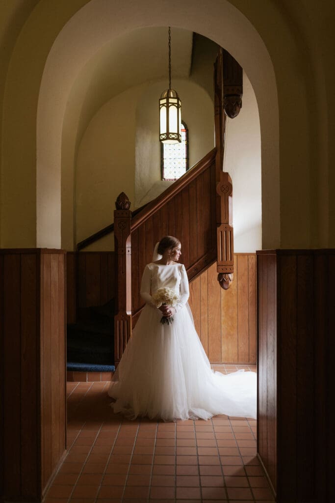 A bridal portrait in the entryway of Saint Benedict's parish in Atchison Kansas