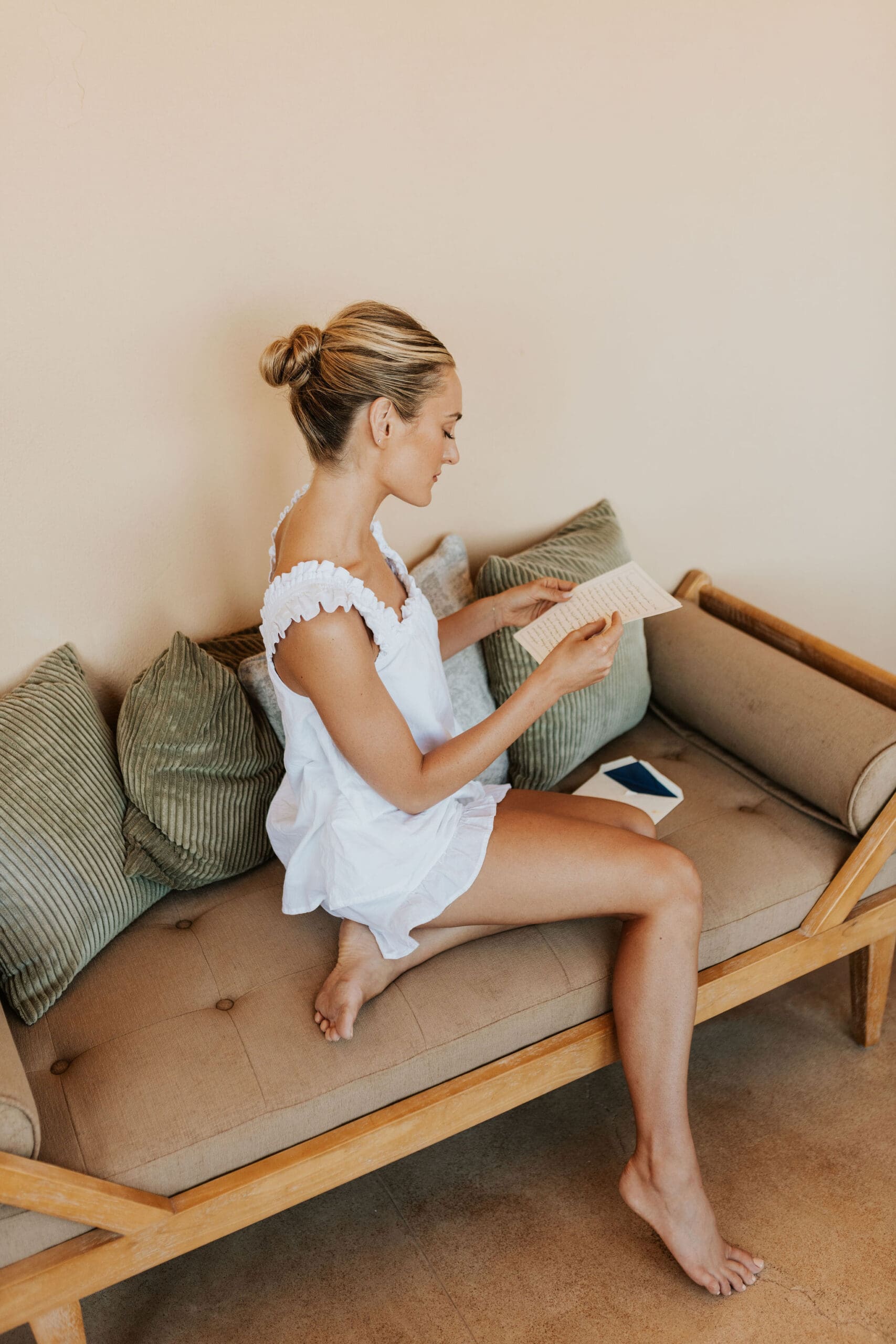 A quiet moment of a bride reading her vows on her wedding dag