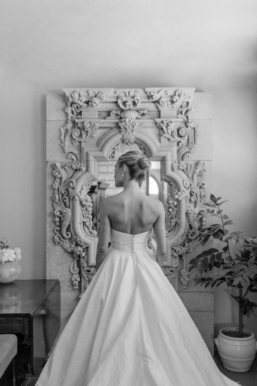 Classic bridal portrait in front of ornate mirror