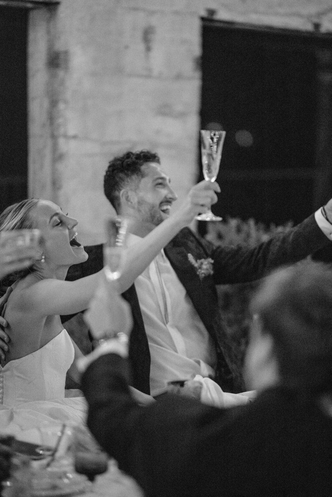 Bride and groom toasting champagne during Arizona wedding reception celebration
