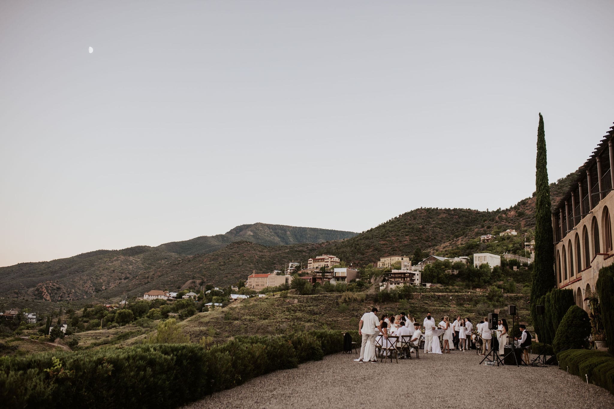 Guests gathered for cocktail hour at Arizona mountain wedding venue overlooking Jerome valley