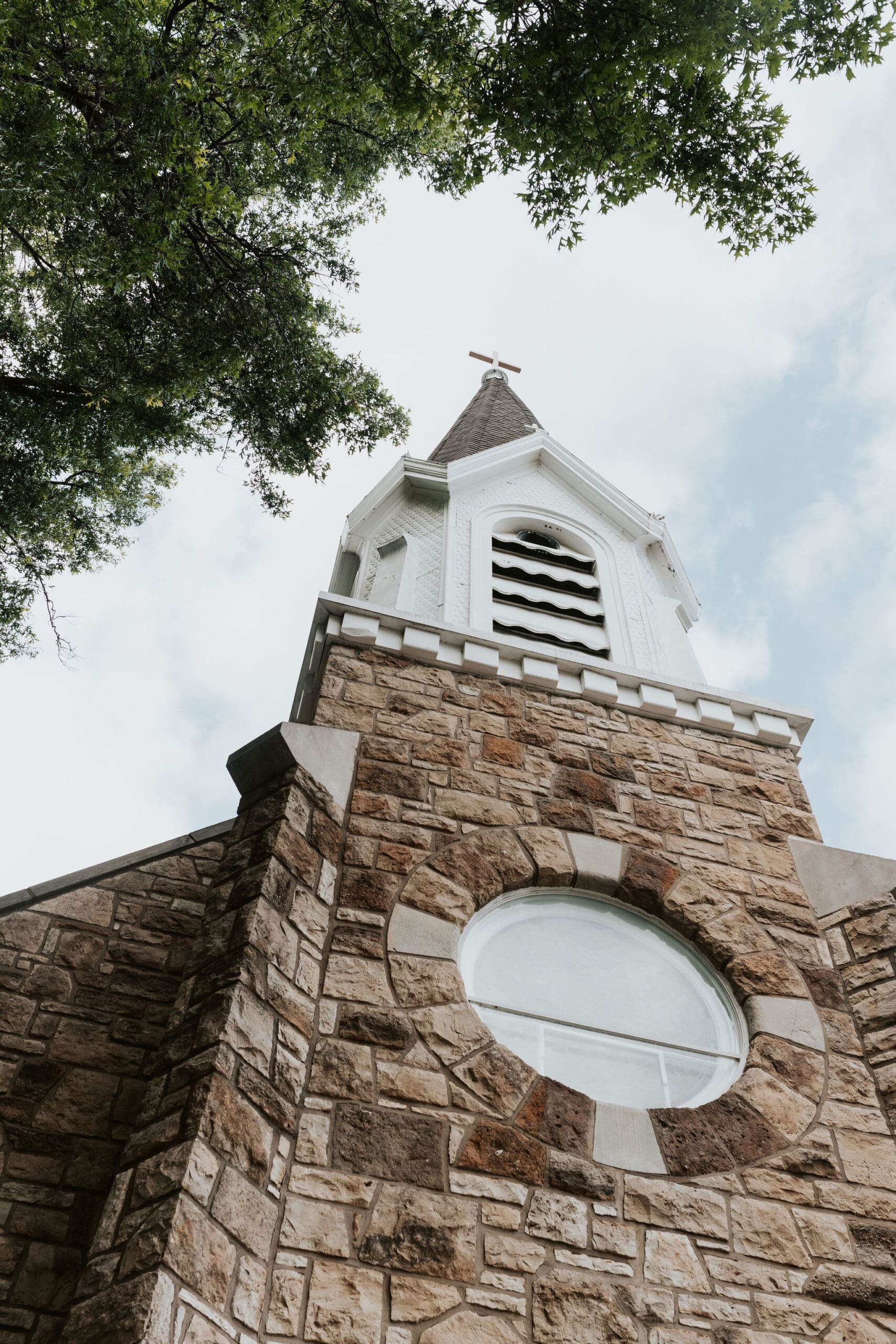stone exterior and bell tower at Holy Trinity church in Kansas