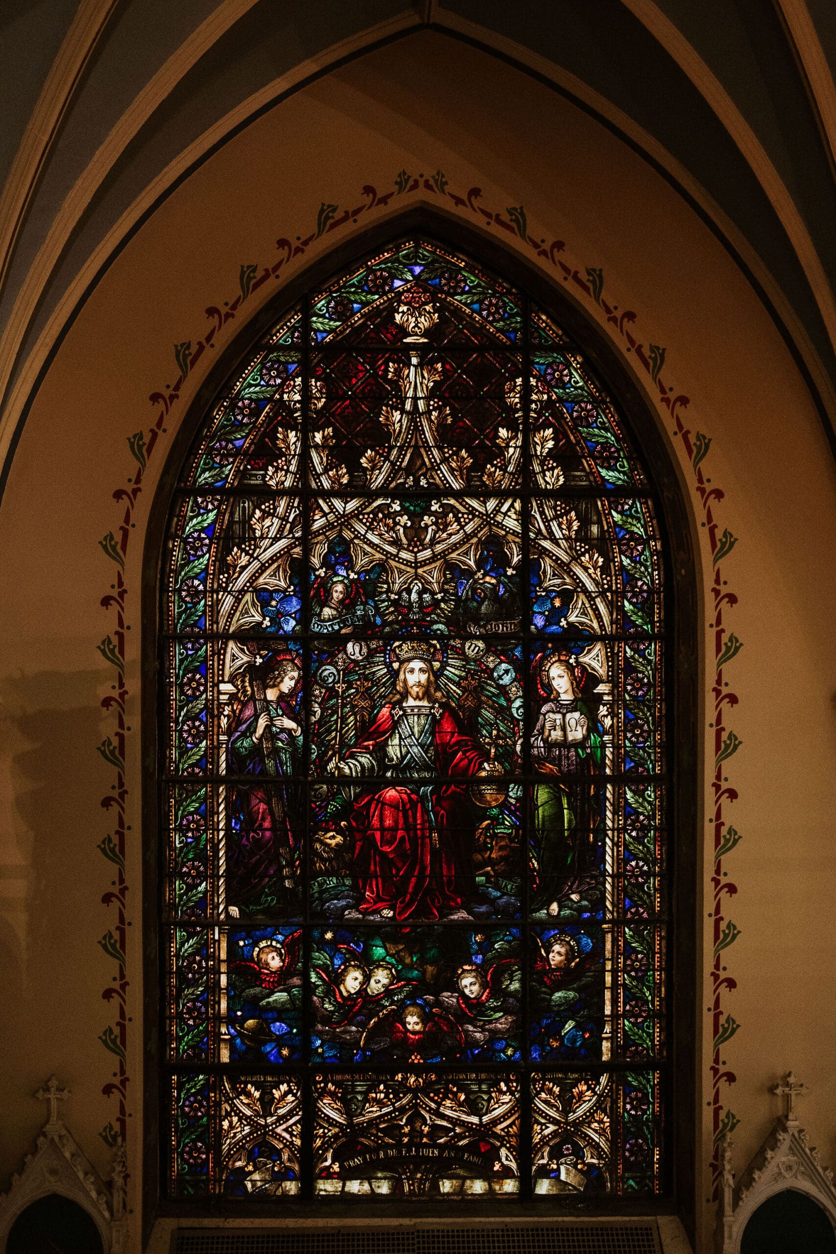 stained glass window inside Our Lady of Perpetual Help with rich catholic church details