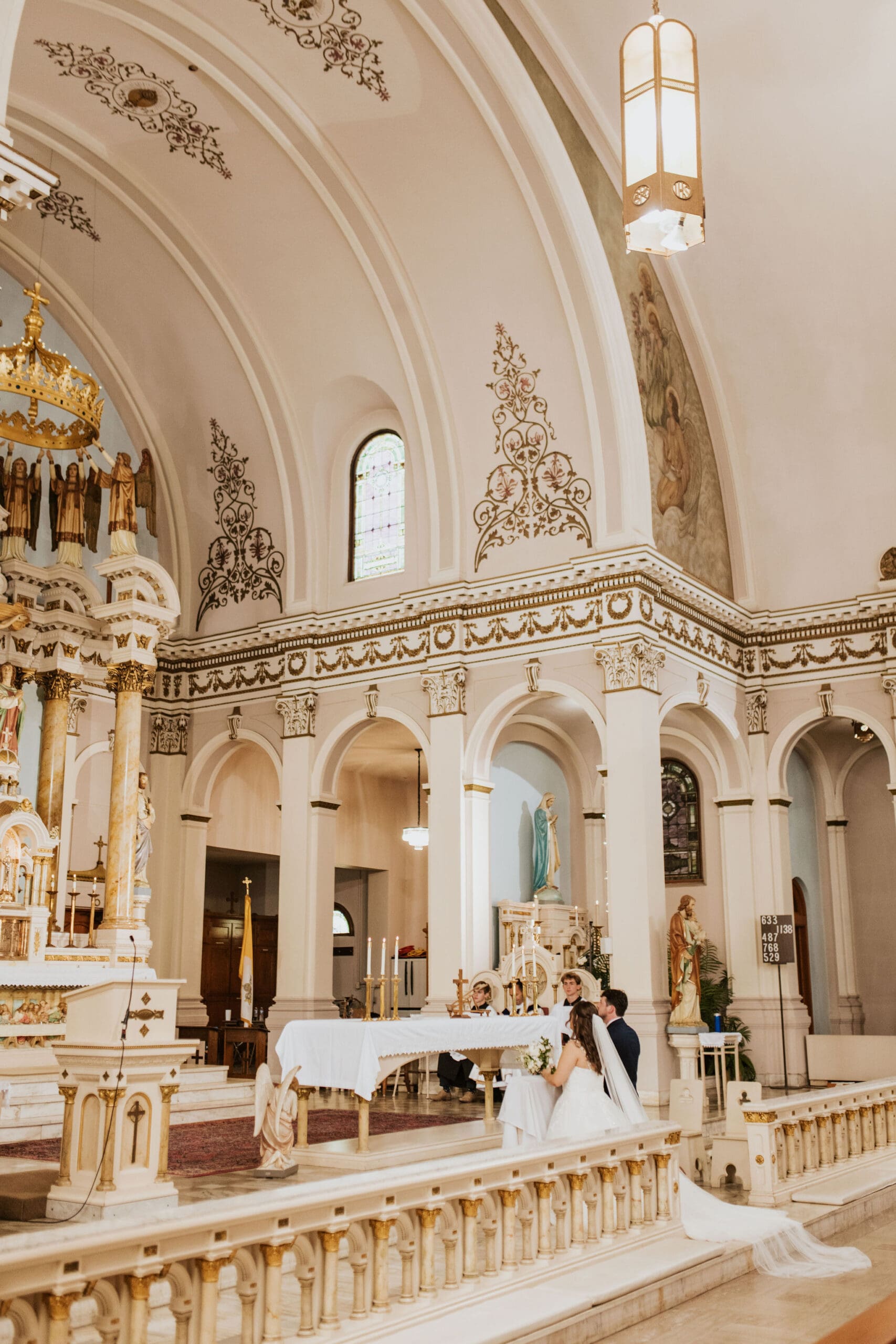 soft natural light inside Our Lady of Sorrows for a timeless Catholic wedding ceremony