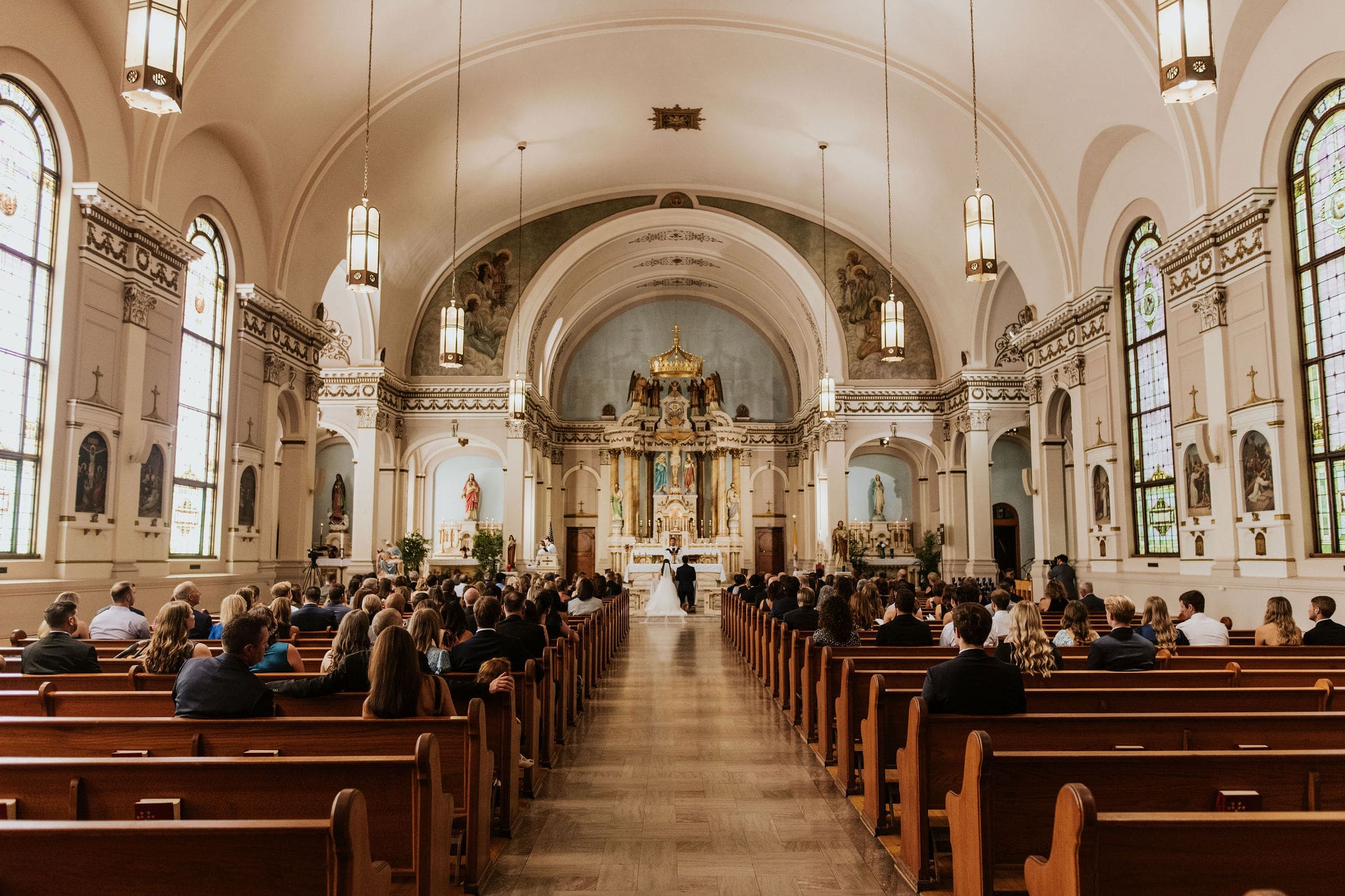 wide church ceremony view inside Our Lady of Sorrows in Kansas City a stunning catholic churches in Kansas City