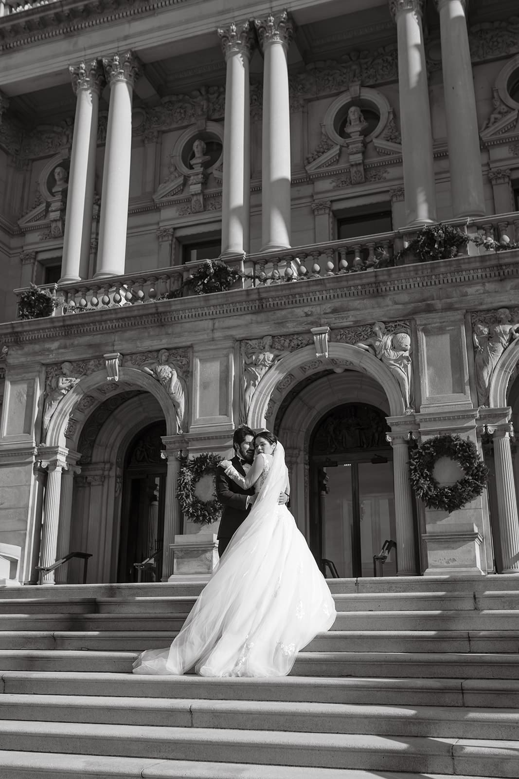 black and white wedding portrait outside lincoln memorial columns