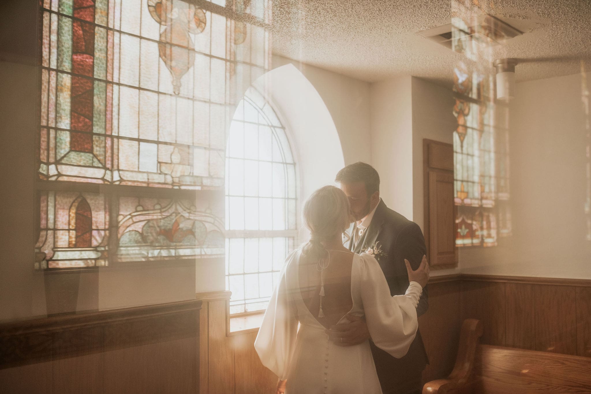 Bride and groom portrait in Holy Trinity Catholic Church Weston MO