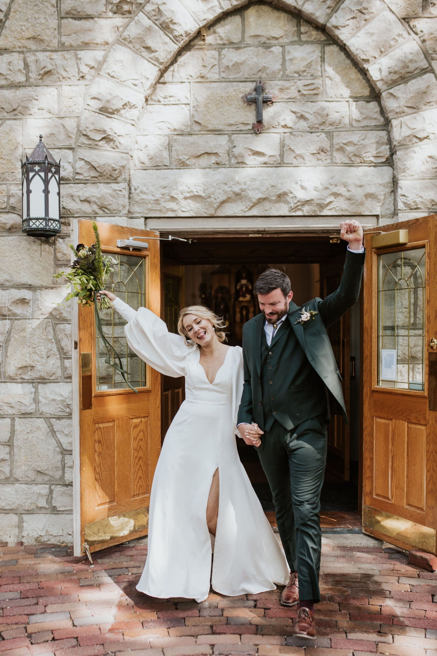Bride and groom leaving Holy Trinity Catholic Church Weston MO after their wedding