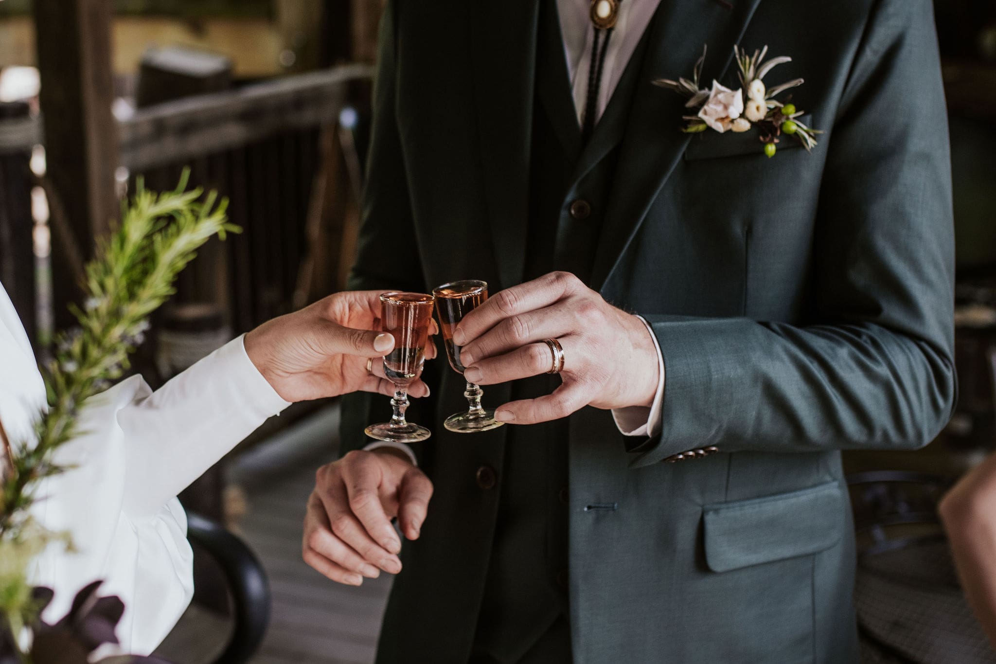 Bride and groom taking shots captured by a Kansas City wedding photographer