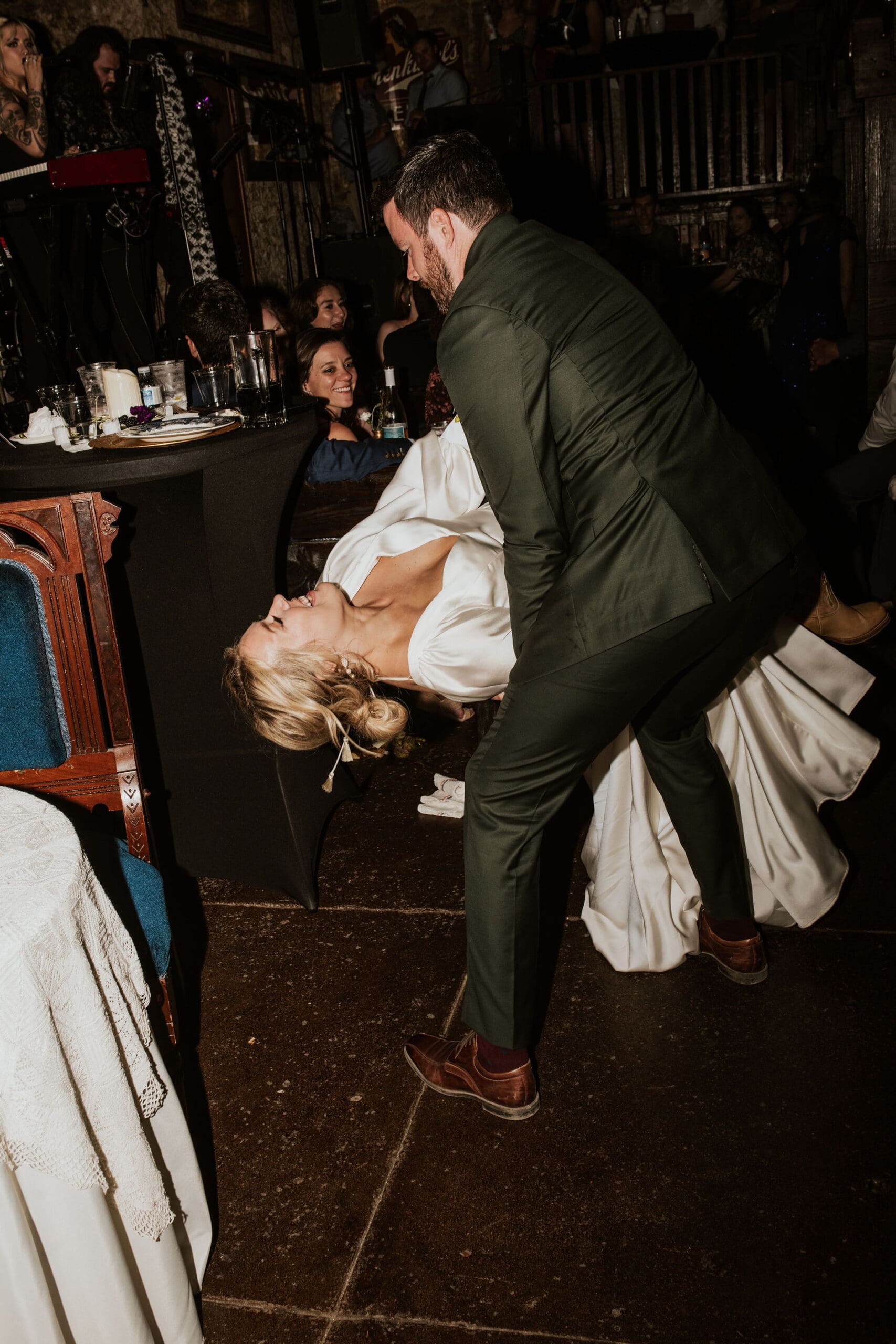 Bride and groom dancing during wedding reception at O'Malley's Pub in Weston MO