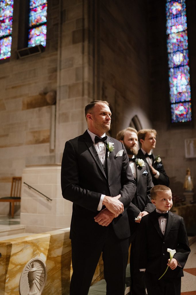 Groomsmen at altar at wedding at Cathedral of Christ the King Atlanta