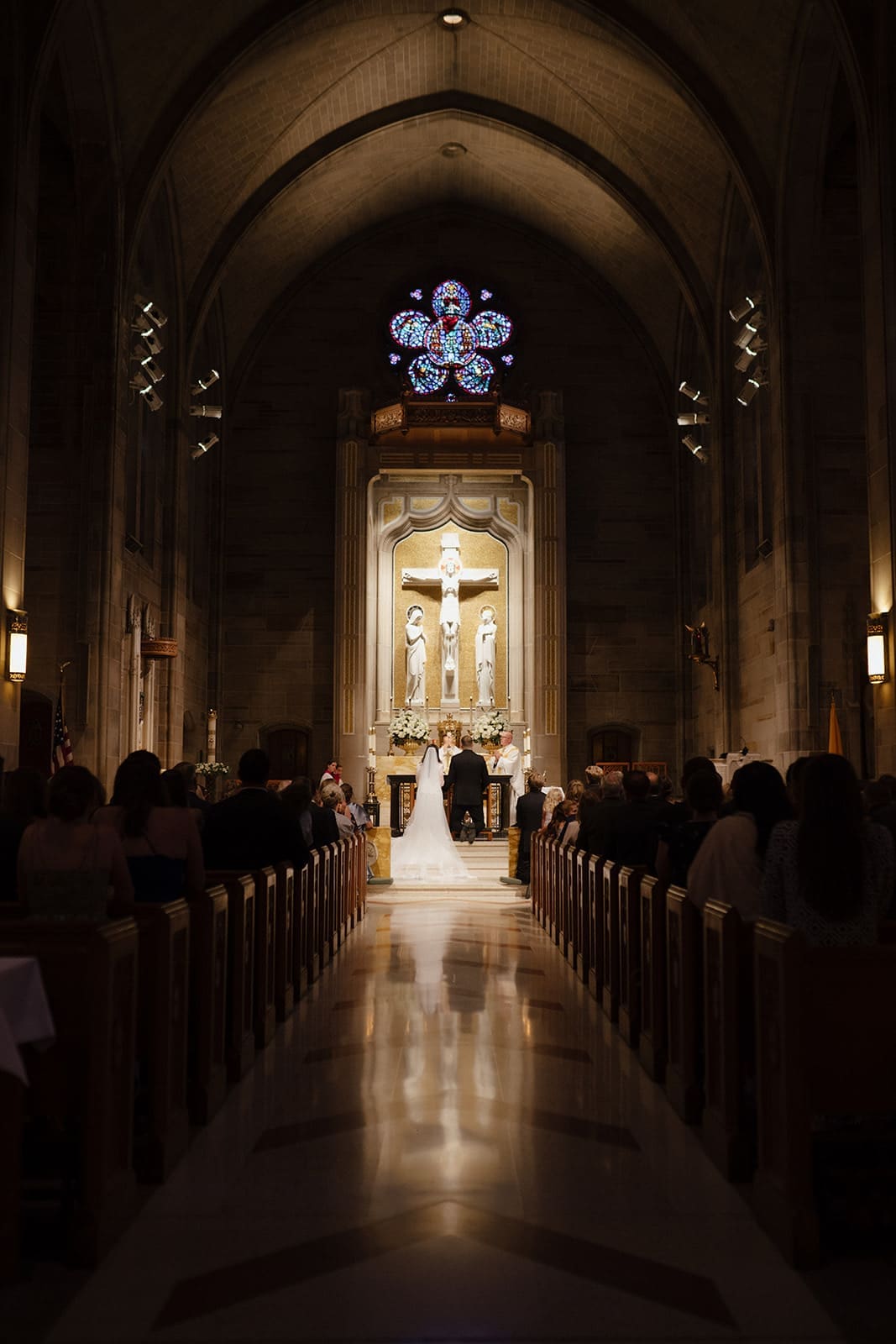 a dramatic image of a dark catholic church on a wedding day