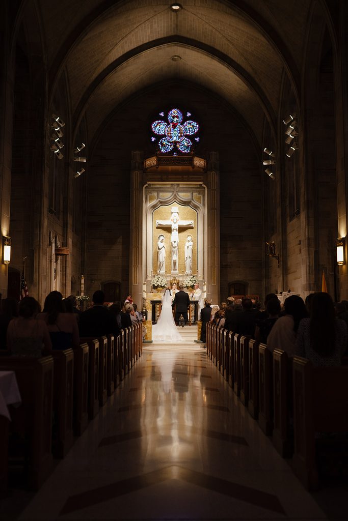 Focal point lighting on Christ and couple for weddings at the Cathedral of Christ the King in Atlanta